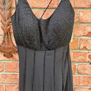 Black cocktail dress with “paned” hem